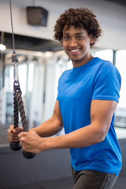 istock Handsome young african american man working out at the gym 1057591192