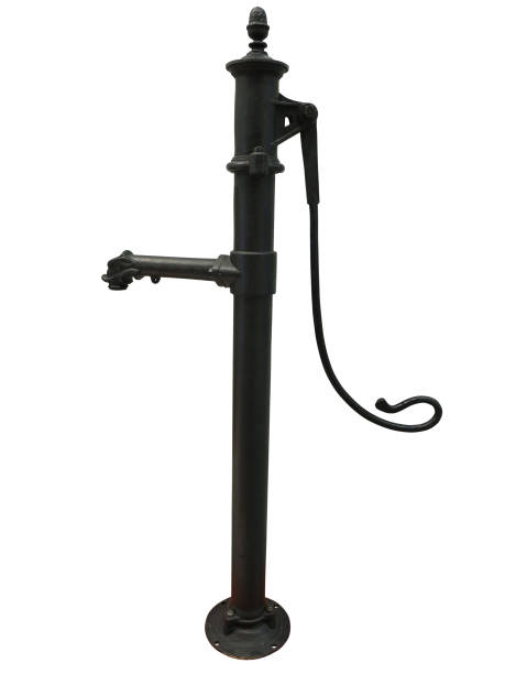 istock Old rusty manual metal water pump isolated over white 1057591740