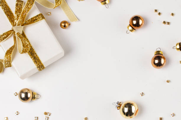 istock Christmas flat lay scene with golden decorations 1057593772