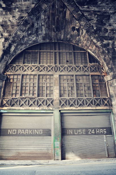 istock No parking place, in use 24 hours notice on old rusty vintage paint corrugated iron garage, Edinburgh, Scotland, United Kingdom 1057596448