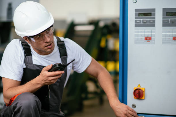 istock Handsome factory worker with walkie-talkie 1057597230