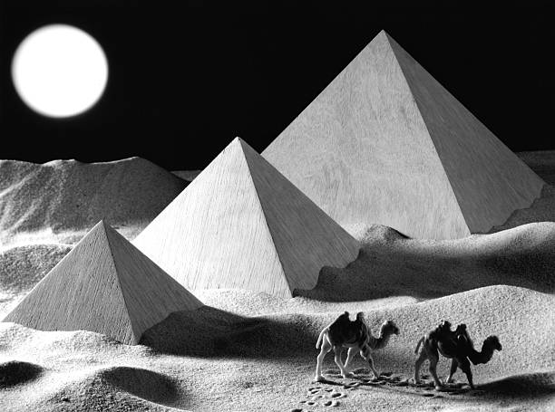 The pyramid of Chephren is one of the Ancient Egyptian Pyramids of Giza that still has cladding at the top. Famous travel destination, sunny day in a touristic area in Cairo, Egypt. Geometric shape, contrast light and shadow in the desert.