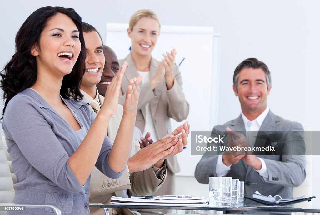Cheerful business people applauding in a meeting Cheerful business people applauding in a meeting. Business concept. Adult Stock Photo