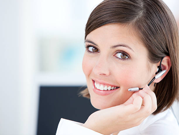 istock Cute businesswoman talking with clients in front of her computer 105760632