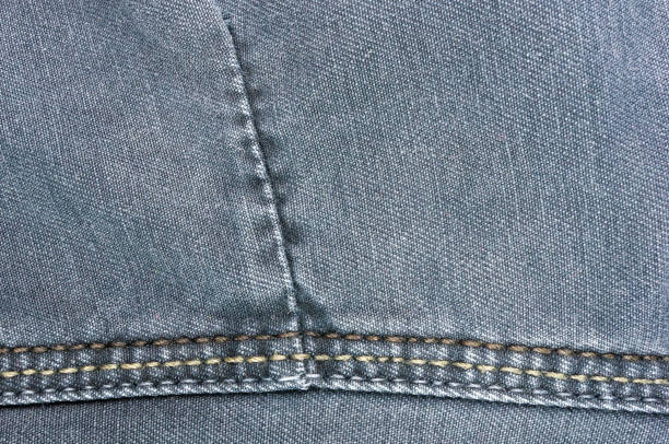 istock clothing items washed cotton fabric texture with seams 1057606732