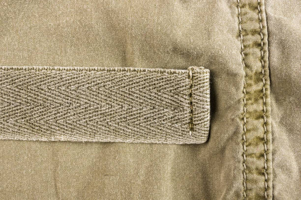 istock clothing items washed cotton fabric texture with seams 1057606884