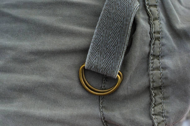 istock clothing items washed cotton fabric texture with seams, clasps, buttons and rivets 1057606888