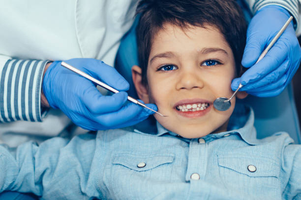istock Cropped Image Of Dentist Examining Boy At Clinic 1057607476