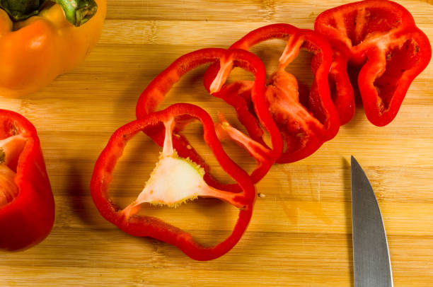 istock sliced fresh red paprika, bell pepper on bamboo cutting board 1057608468
