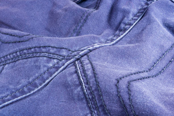 clothing items washed cotton fabric texture with seams, macro, close-up