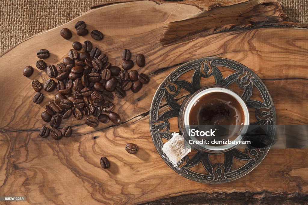 Turkish coffee cup and coffee beans on wooden ground Coffee beans and coffee cup Above Stock Photo