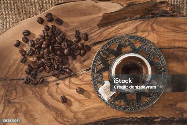 Turkish Coffee Cup And Coffee Beans On Wooden Ground Stock Photo - Download Image Now