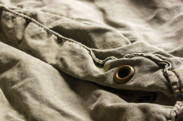 istock clothing items washed cotton fabric texture with seams, clasps, buttons and rivets 1057612696