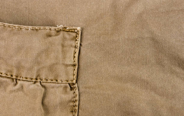 istock clothing items washed cotton fabric texture with seams 1057613212