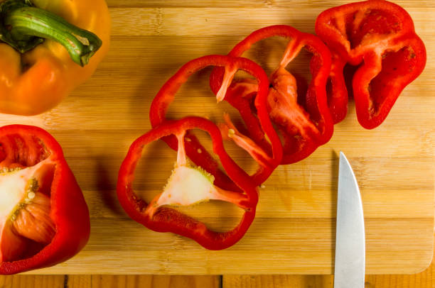 istock sliced fresh red paprika, bell pepper on bamboo cutting board 1057613232
