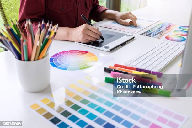 Image Of Female Creative Graphic Designer Working On Color Selection And Drawing On Graphics Tablet At Workplace Stock Photo - Download Image Now