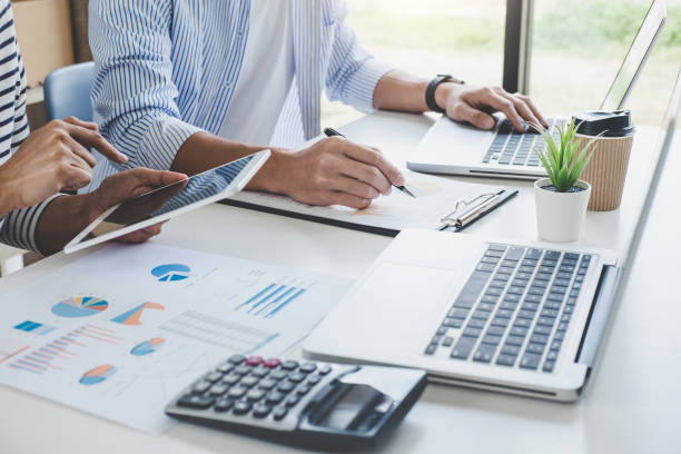 istock Business team collaboration discussing working analysis with financial data and marketing growth report graph in team, Meeting Talking Brainstorming Communication Concept 1057614428