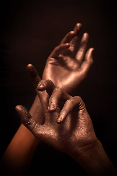 istock beautiful man's hands in bronze paint 105761701