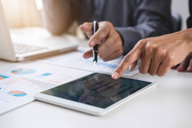 co working conference, business team meeting present, investor colleagues discussing new plan financial graph data on office table with laptop and digital tablet, finance, accounting, investment - growth plan graph digital tablet imagens e fotografias de stock