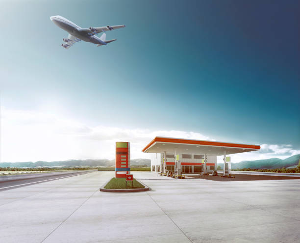 istock plane flying over gas station 1057617864