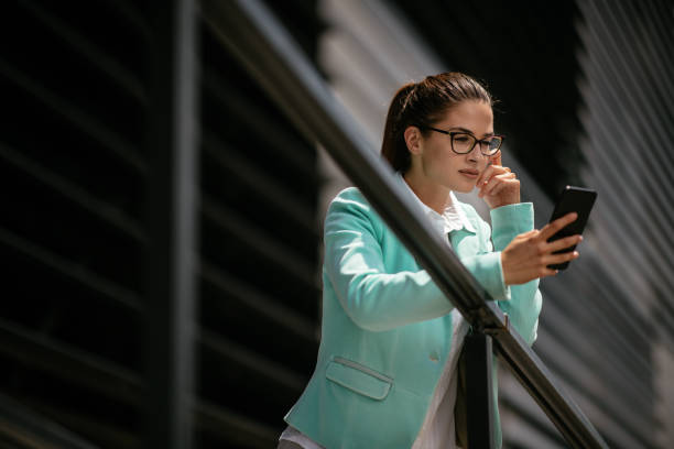 istock Business woman using mobile phone 1057621206