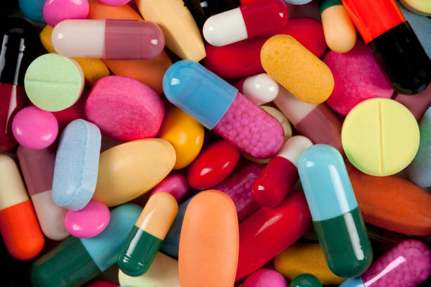 colorful medicine pills and tablets - antibiotic red medicine healthcare and medicine imagens e fotografias de stock
