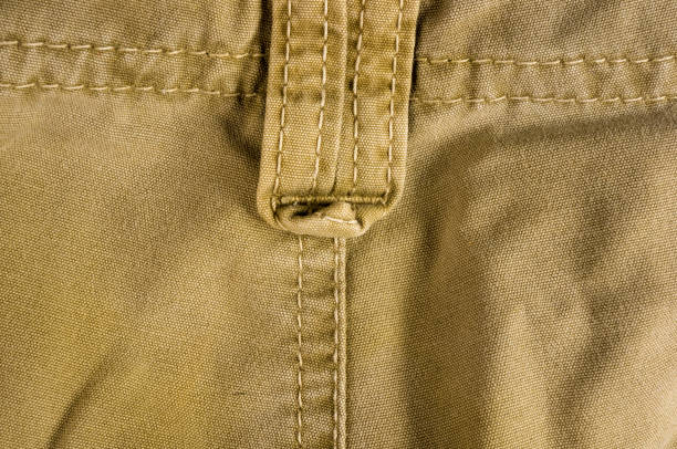 istock clothing items washed cotton fabric texture with seams 1057622028