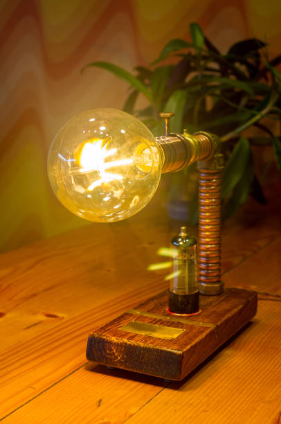 Light fixture handmade in vintage style, wooden case and radio tube, copper finish, led lamp