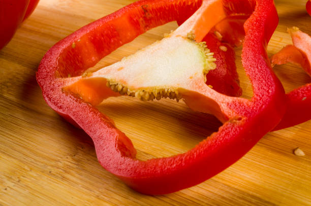 istock sliced fresh red paprika, bell pepper on bamboo cutting board 1057627750