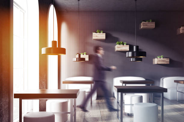 istock Businessman in black wall cozy restaurant interior 1057631158