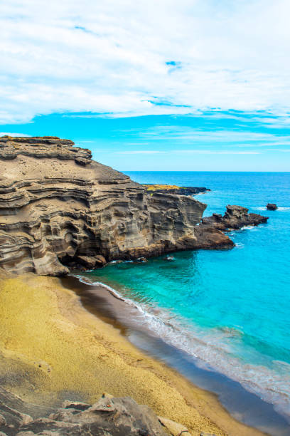istock View of the beach Papakolea (green sand beach), Hawaii, USA. Copy space for text. Vertical. 1057634740