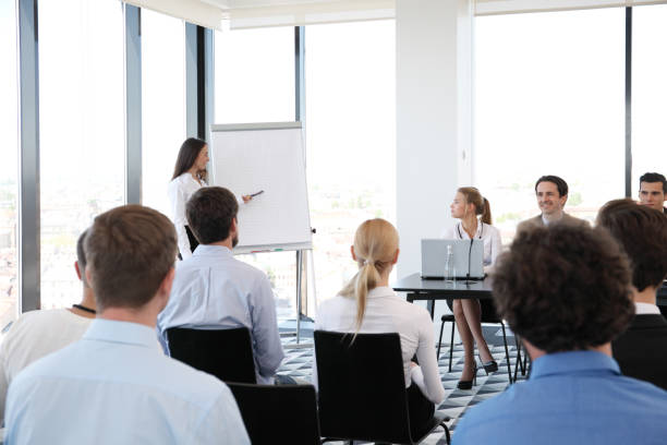 istock Speakers at business meeting 1057644216