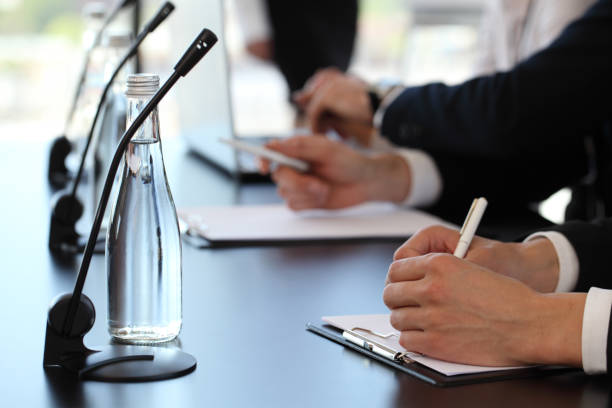 istock Speakers at business meeting 1057644248