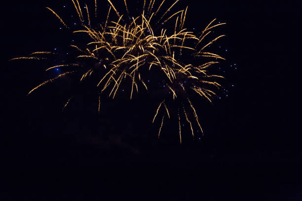 istock Background with Golden and Blue Firework with Free Space for Text 1057649910