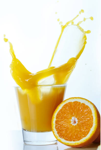 istock Orange juice with cut fruit 1057650244