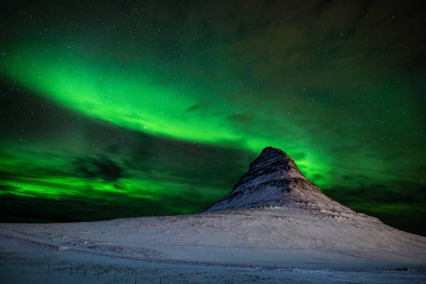 istock Mount kirkjufell in iceland with aurora borealis 1057653852