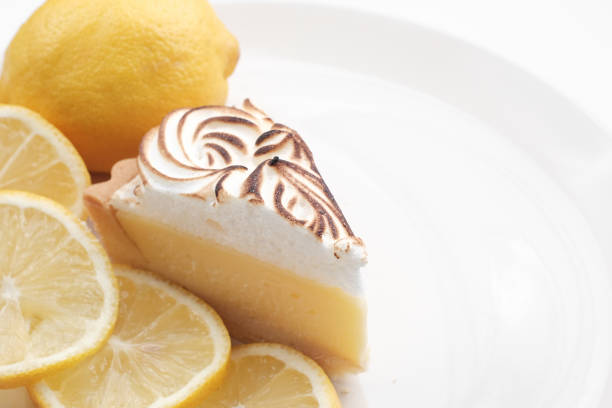 istock Lemon cheese tart on white background - Soft Focus 1057653982