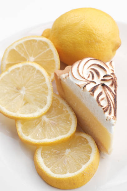 istock Lemon cheese tart on white background - Soft Focus 1057654044