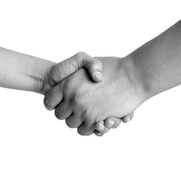 istock Man and woman handshake 105765706