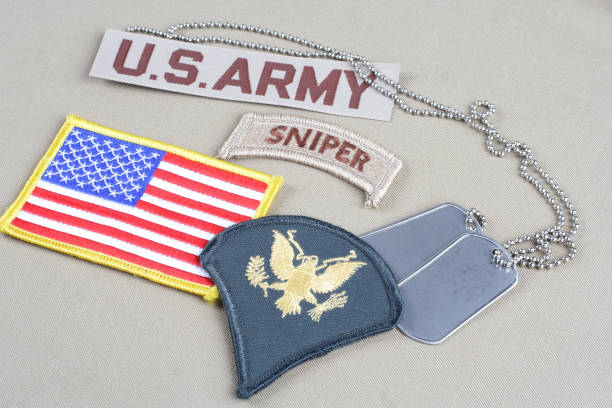 istock US ARMY Specialist rank patch, sniper tab, flag patch and dog tag 1057659520