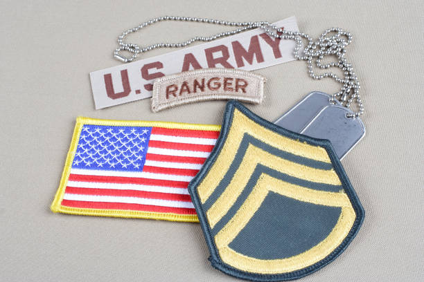 istock US ARMY Staff Sergeant rank patch, ranger tab, flag patch and dog tag 1057659938