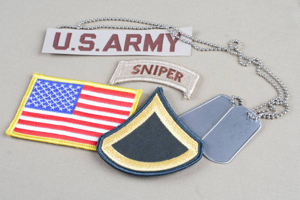 istock US ARMY Private First Class rank patch, sniper tab, flag patch and dog tag 1057660168