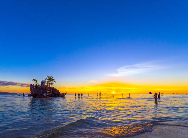 BORACAY, PHILIPPINES - FEBRUARY 28, 2018: Sunset on the sandy beach. Copy space for text