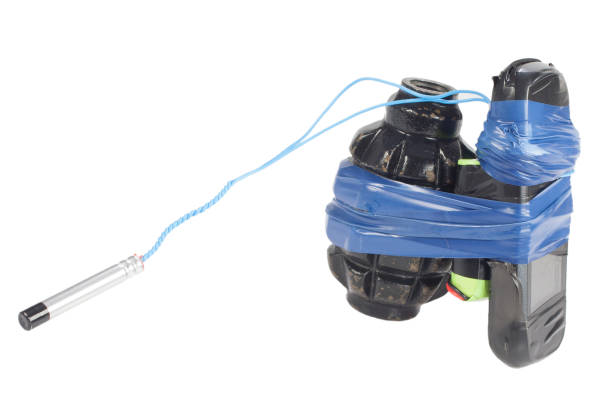 istock Improvised Explosive Device (IED) - hand grenade with cell phone isolated on white 1057660874
