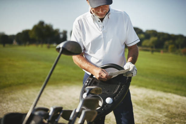 istock Senior man reading his scorecard during a golf game 1057662334
