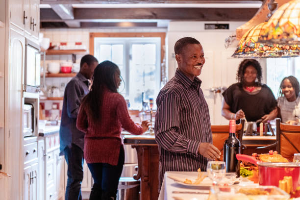 istock Thanksgiving dinner with American-African family preparing dinner 1057662462