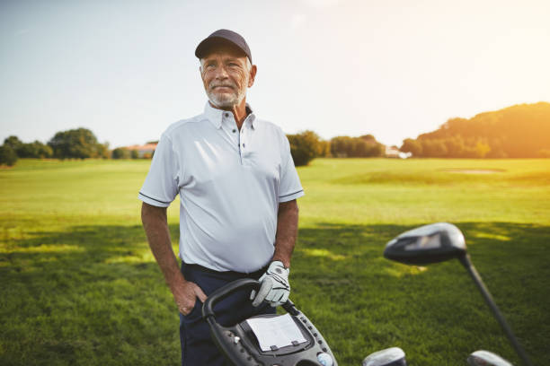 istock Senior man standing with his clubs on a golf course 1057662698