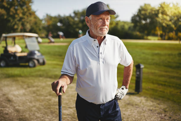 istock Senior man looking down the fairway of a golf course 1057662904