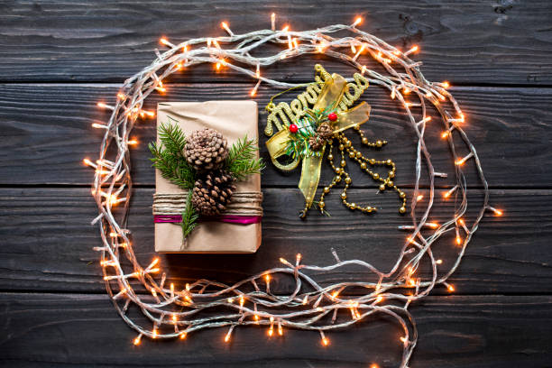 istock Christmas composition with gifts on black wooden board 1057666272