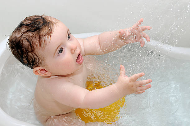 istock Cute baby playing with water 105766639